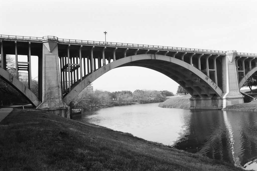 Bridge with green grass in forground