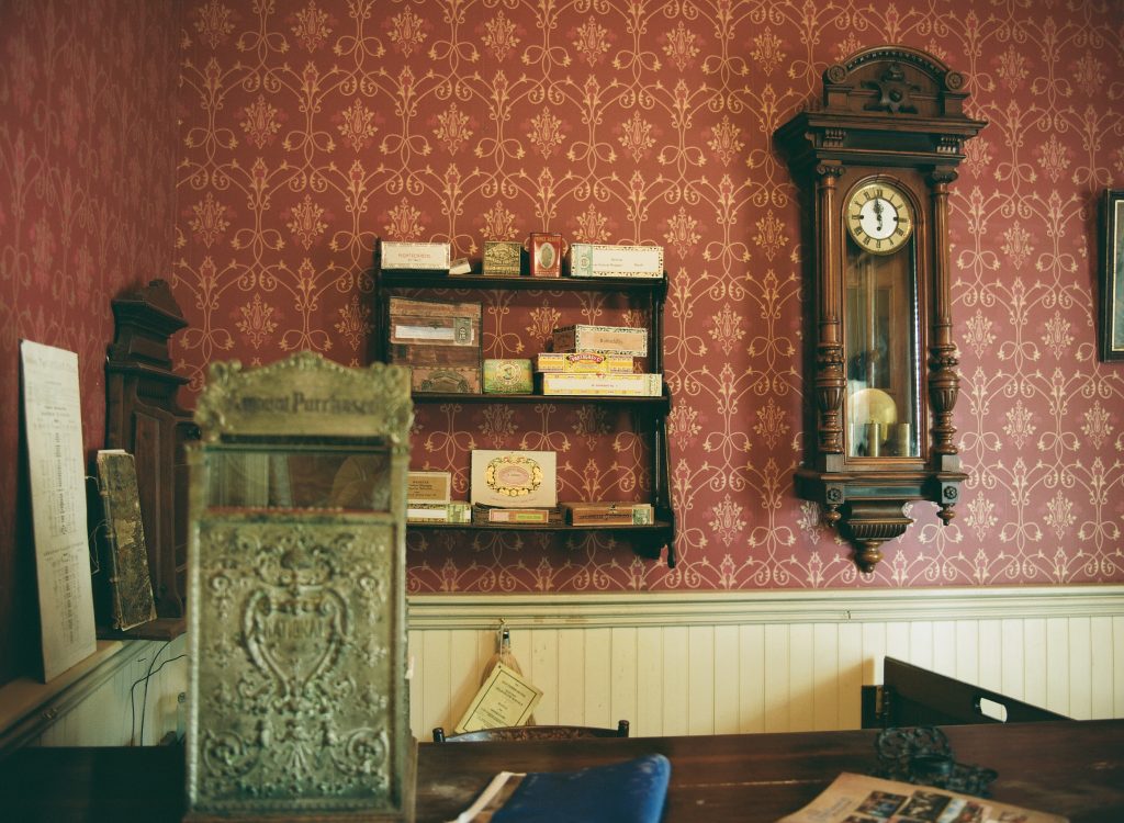 Southern Hotel Lobby. Wichita Old Cowtown, August 2022. Mamiya 645AFD, 55mm, f/4.5, 1/6 sec. Developed and scanned by The Darkroom.