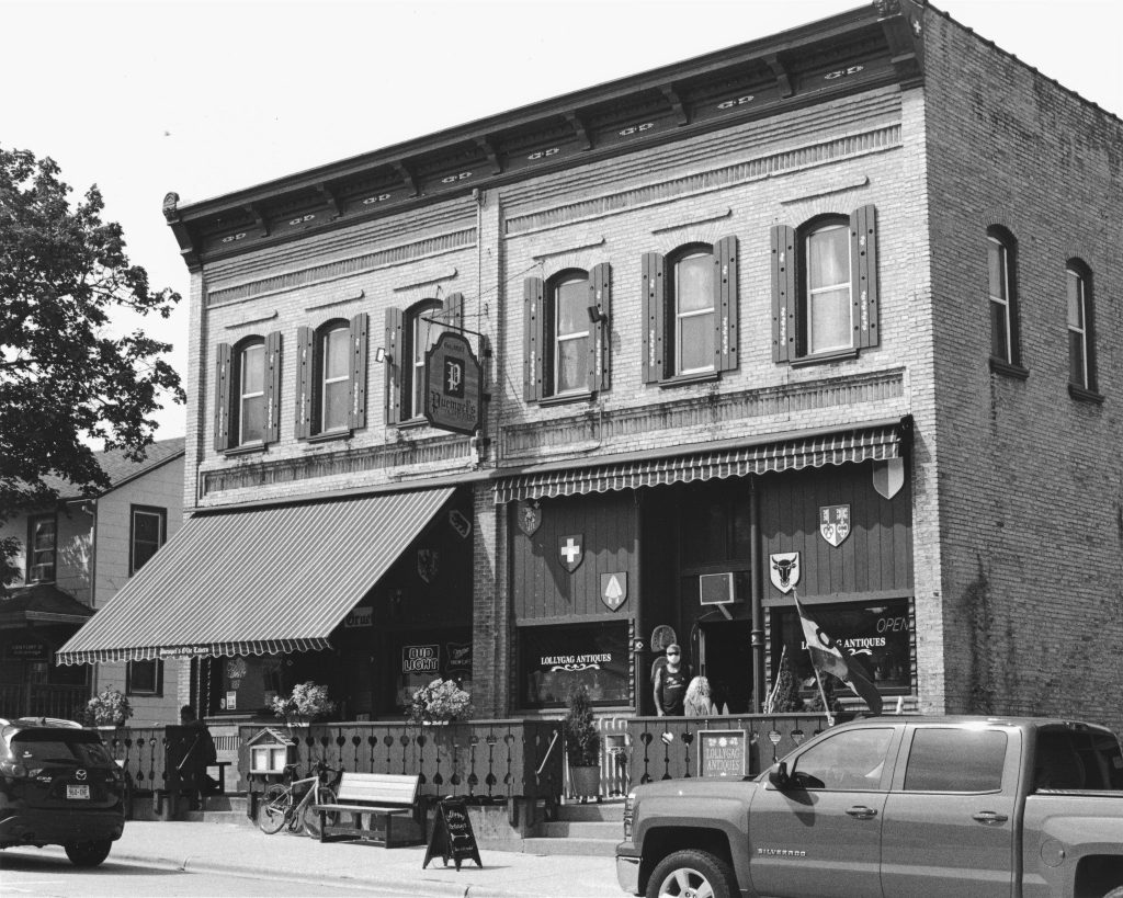 A local tavern that's been in business for over 115 years. Scan of a darkroom print. Shot with a Rollei 35. T-Max 400 processed in D-76.